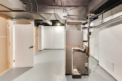 a view of a brick house with a large windows