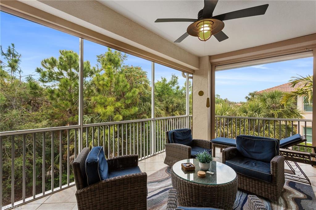 7825 Hawthorne Drive, Unit 2104 Naples, FL 34113 - Photo 15 of 43 a balcony with furniture and a potted plant
