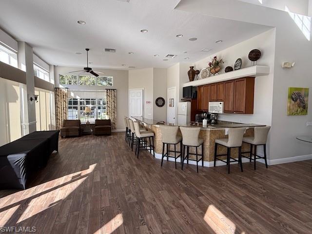 7825 Hawthorne Drive, Unit 2104 Naples, FL 34113 - Photo 39 of 43 a living room with furniture and wooden floor