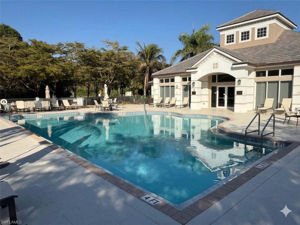 7825 Hawthorne Drive, Unit 2104 Naples, FL 34113 - Photo 43 of 43 a front view of a house with garden
