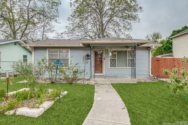 a front view of a house with a yard and porch