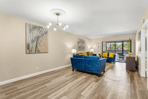 a room with wooden floor and furniture