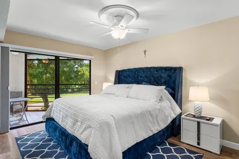a bedroom with a large bed and a large window