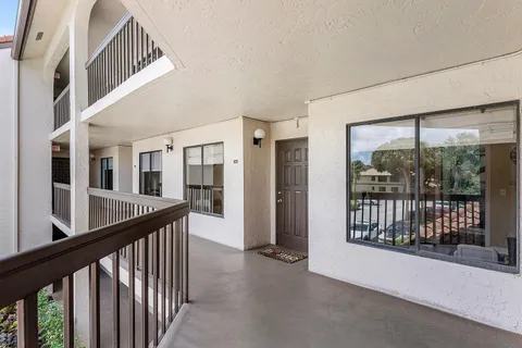 a view of staircase with large windows