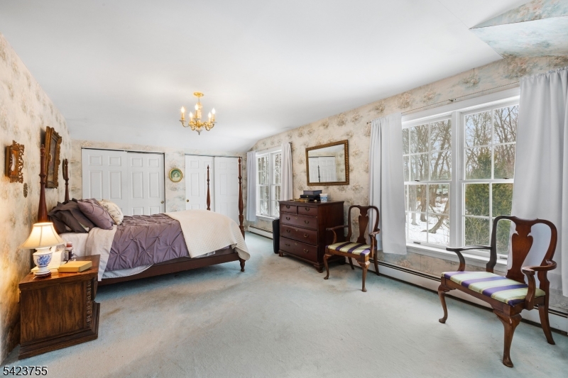 691 Ridgedale Avenue East Hanover, NJ 07936 - Photo 21 of 49 a bedroom with furniture and a window
