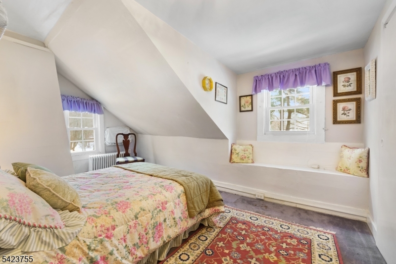 691 Ridgedale Avenue East Hanover, NJ 07936 - Photo 24 of 49 a bedroom with a bed next to a window