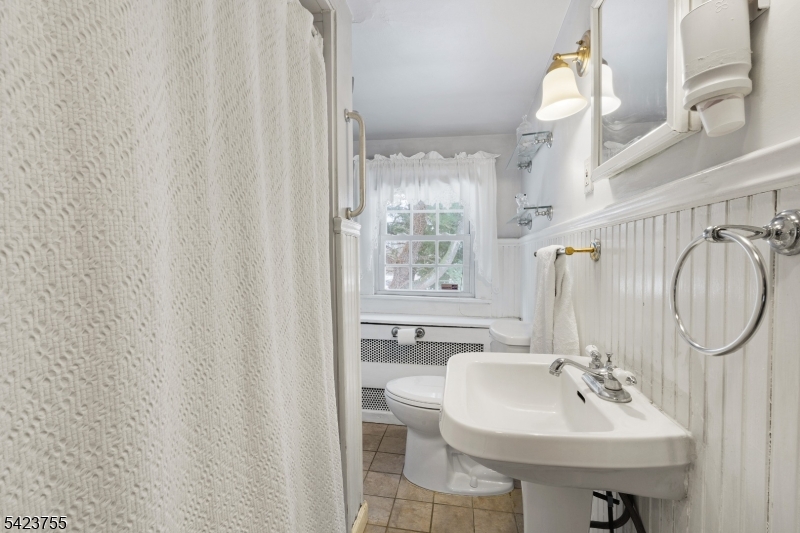 691 Ridgedale Avenue East Hanover, NJ 07936 - Photo 28 of 49 a bathroom with a sink a toilet and a mirror