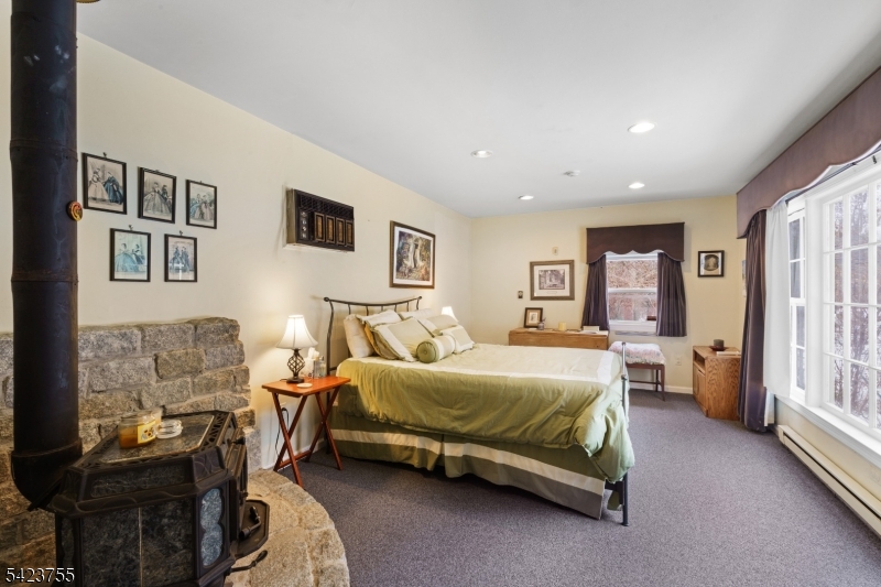 691 Ridgedale Avenue East Hanover, NJ 07936 - Photo 30 of 49 a bedroom with a bed and wooden floor