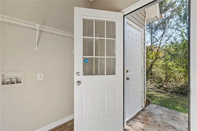 a view of a door and small window