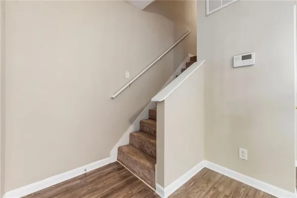 a view of entryway with wooden floor