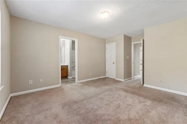 an empty room with closet area