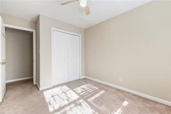 a view of a room with a dresser