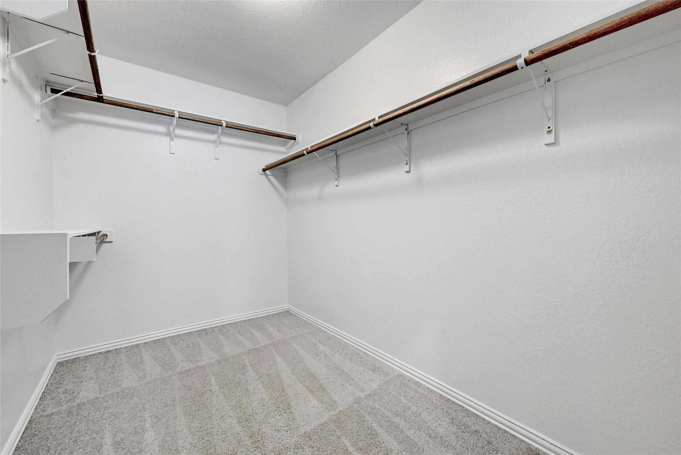 1384 Harwell Loop Kyle, TX 78640 - Photo 17 of 27 a view of a room with racks on the wall