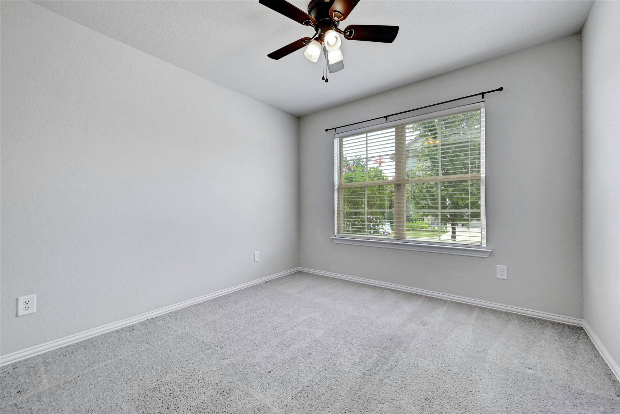 1384 Harwell Loop Kyle, TX 78640 - Photo 19 of 27 a view of a livingroom with a ceiling fan and window
