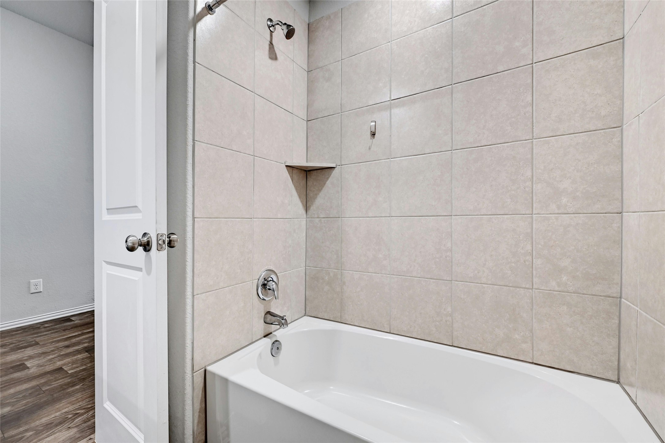 1384 Harwell Loop Kyle, TX 78640 - Photo 21 of 27 a bathroom with a bathtub and shower