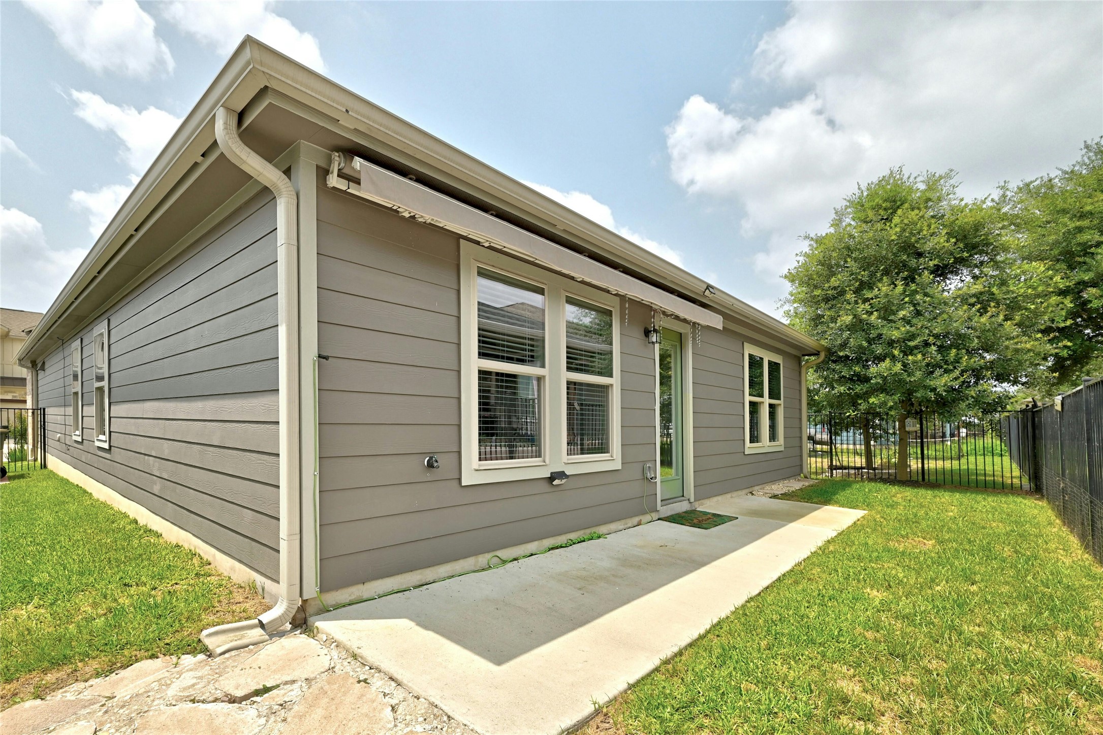 1384 Harwell Loop Kyle, TX 78640 - Photo 24 of 27 a front view of a house with a yard