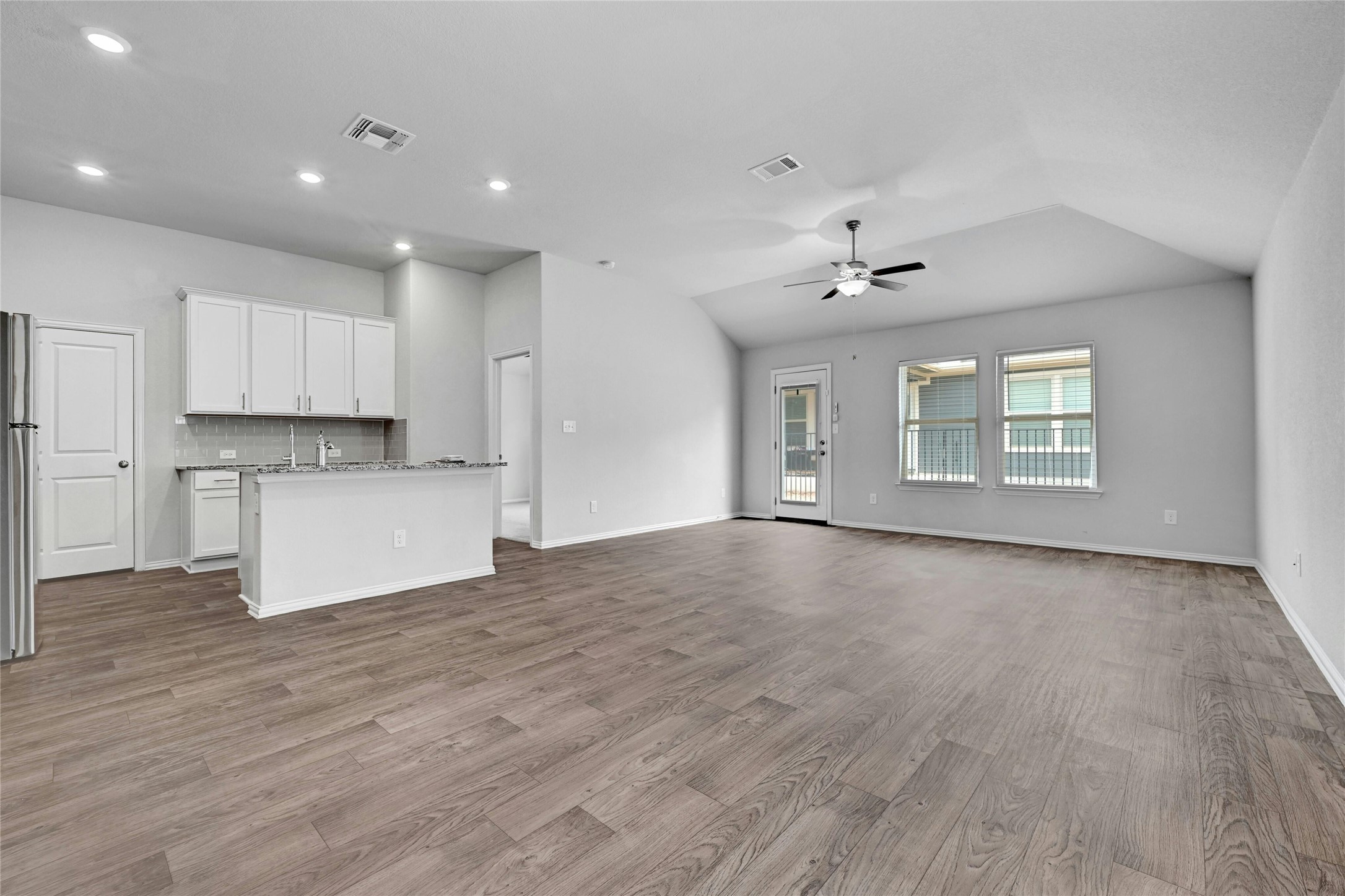 1384 Harwell Loop Kyle, TX 78640 - Photo 4 of 27 a view of an empty room with kitchen appliances and a window