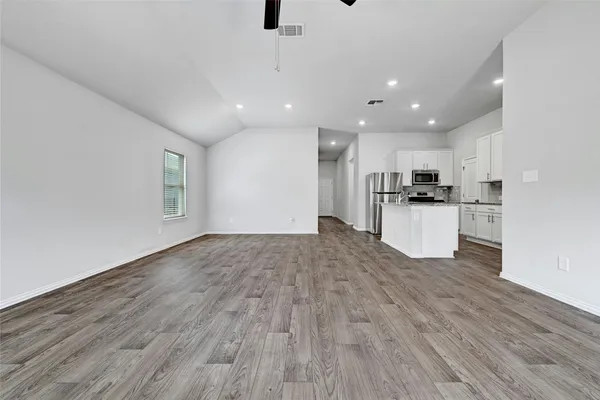 a view of kitchen with wooden floor