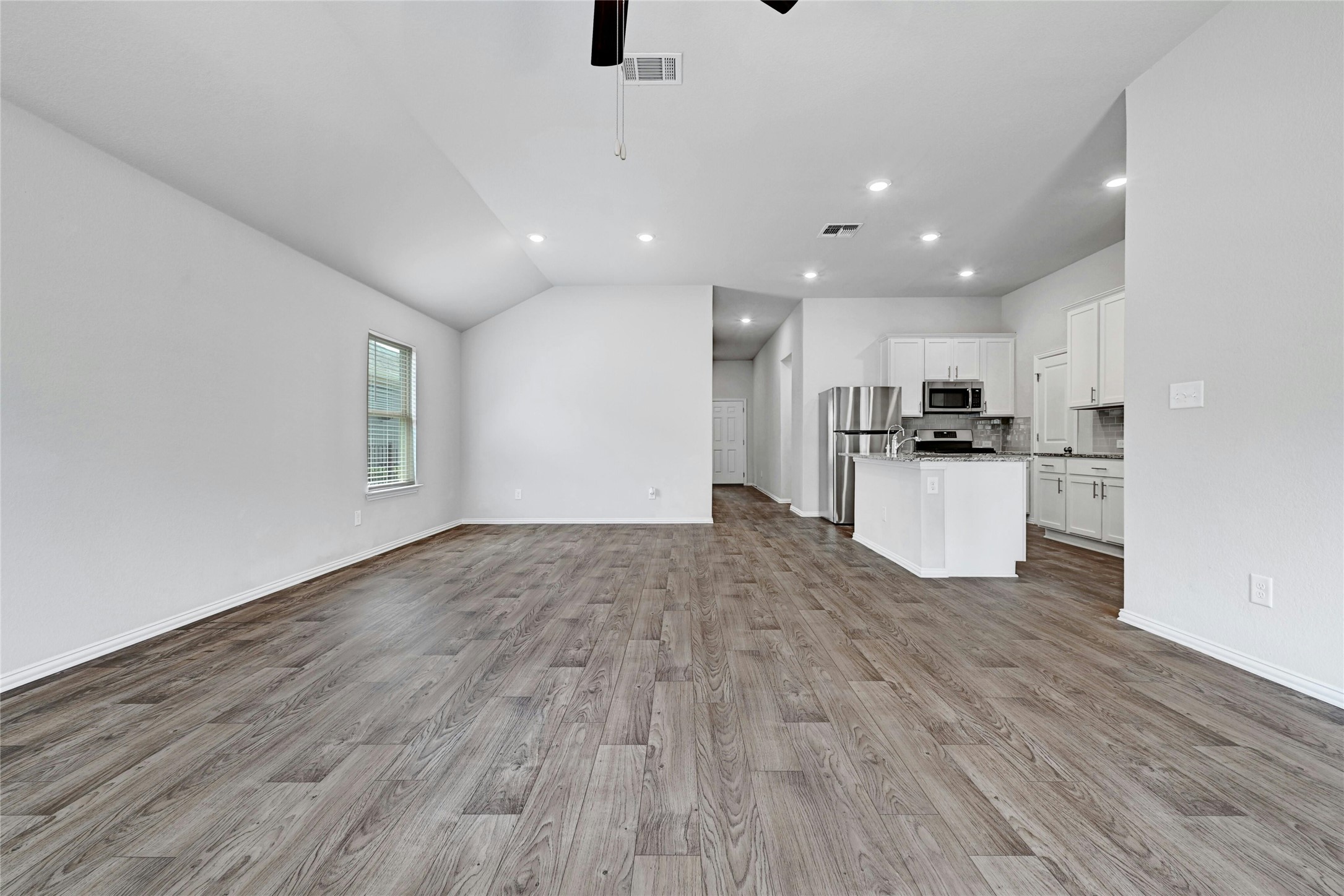 1384 Harwell Loop Kyle, TX 78640 - Photo 8 of 27 a view of kitchen with wooden floor