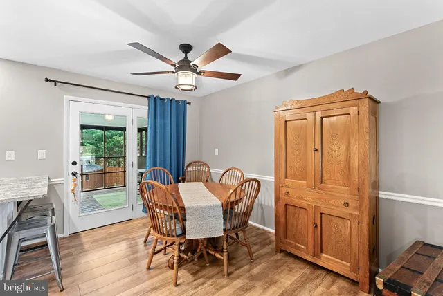 a dining room with furniture window wooden floor