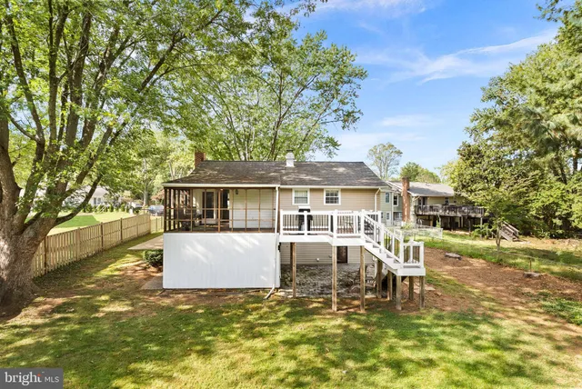 a front view of a house with a yard garage and outdoor seating