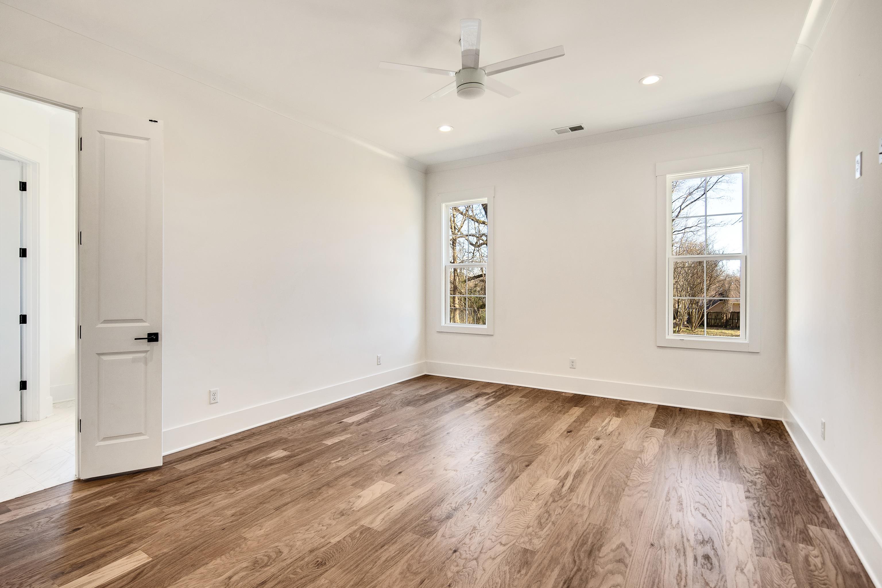 641 Fletcher Road Collierville, TN 38017 - Photo 13 of 37 wooden floor in an empty room with a window