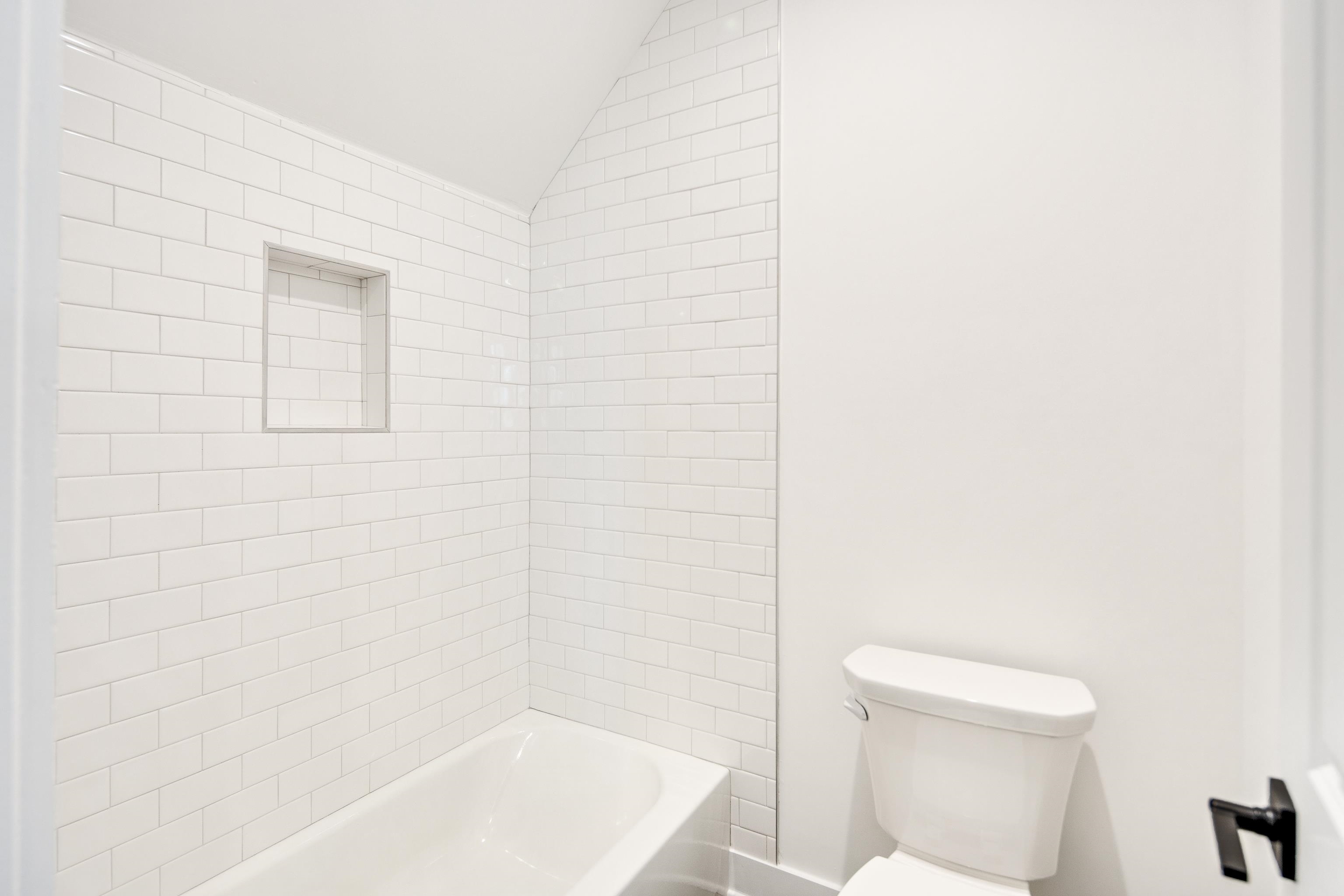 641 Fletcher Road Collierville, TN 38017 - Photo 32 of 37 a white toilet sitting next to a shower