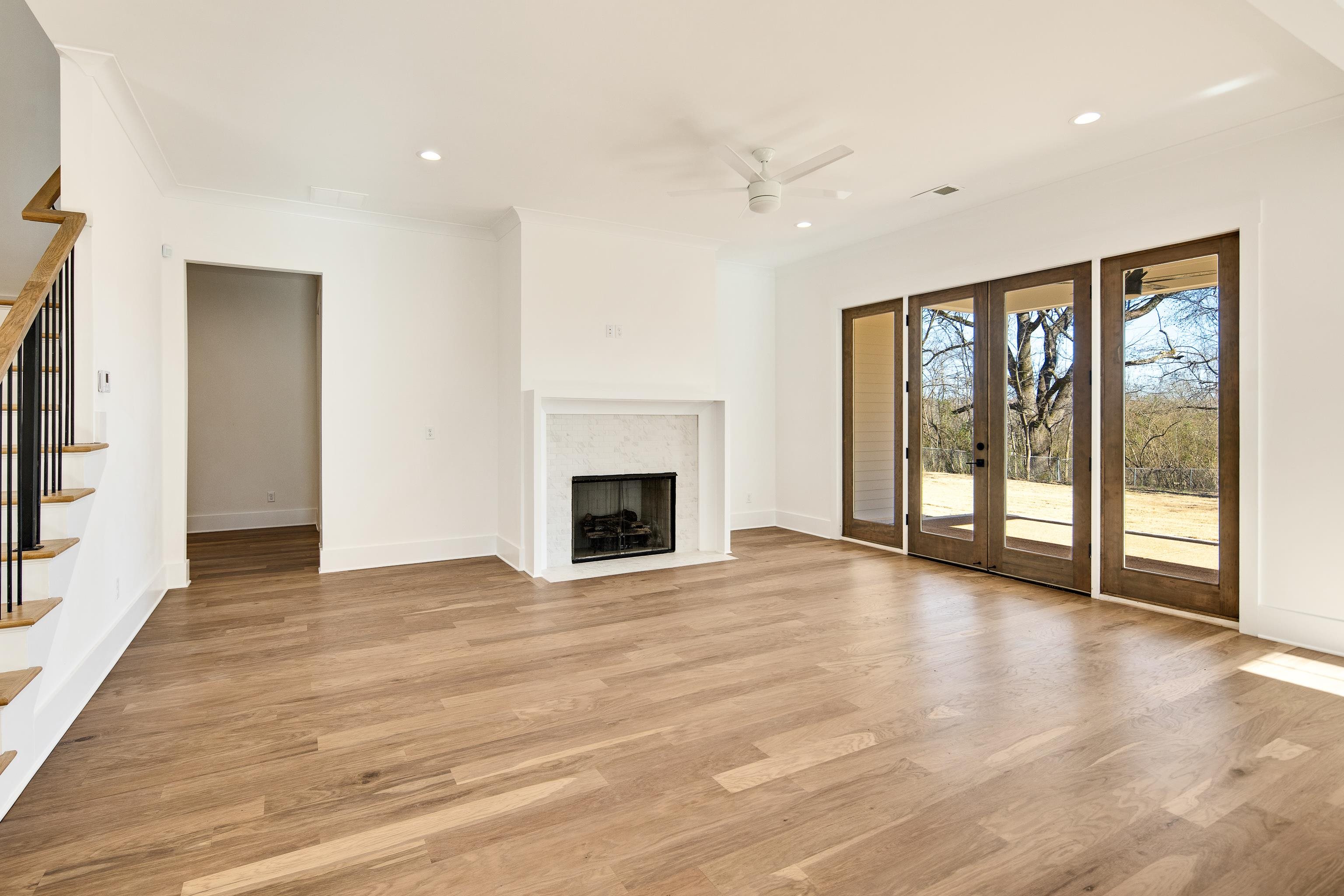 641 Fletcher Road Collierville, TN 38017 - Photo 6 of 37 a view of an empty room with wooden floor and a window