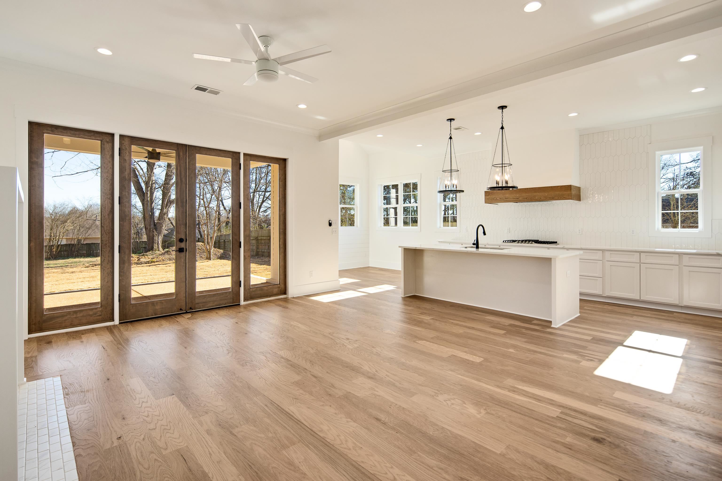 641 Fletcher Road Collierville, TN 38017 - Photo 7 of 37 a view of an empty room with wooden floor and a window
