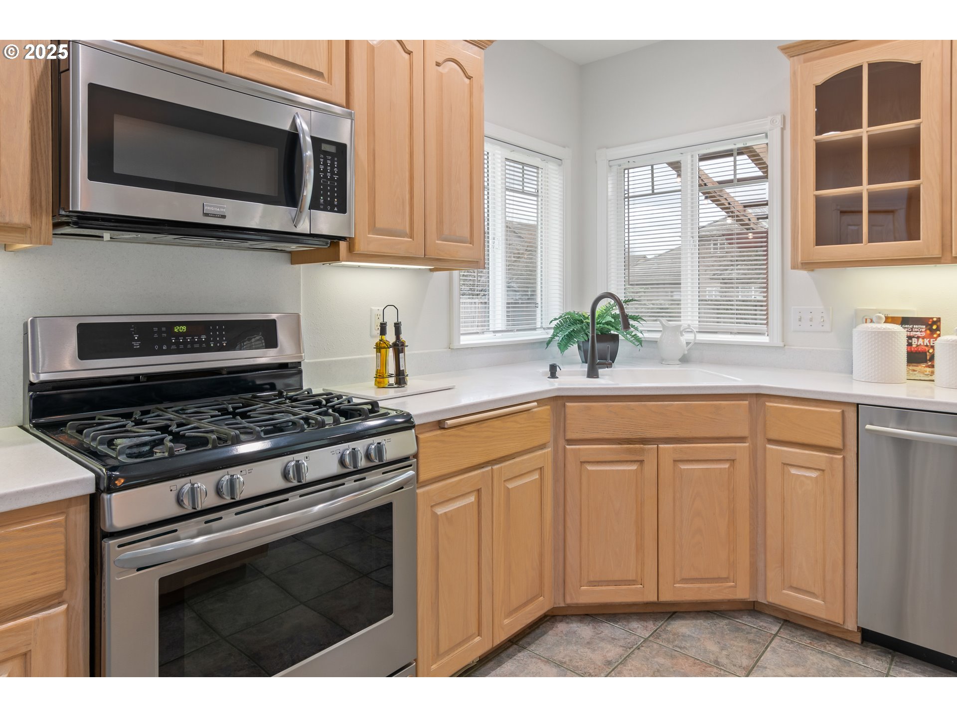 2360 Dale Avenue Eugene, OR 97408 - Photo 12 of 48 a kitchen with stainless steel appliances white cabinets granite counter tops and a window