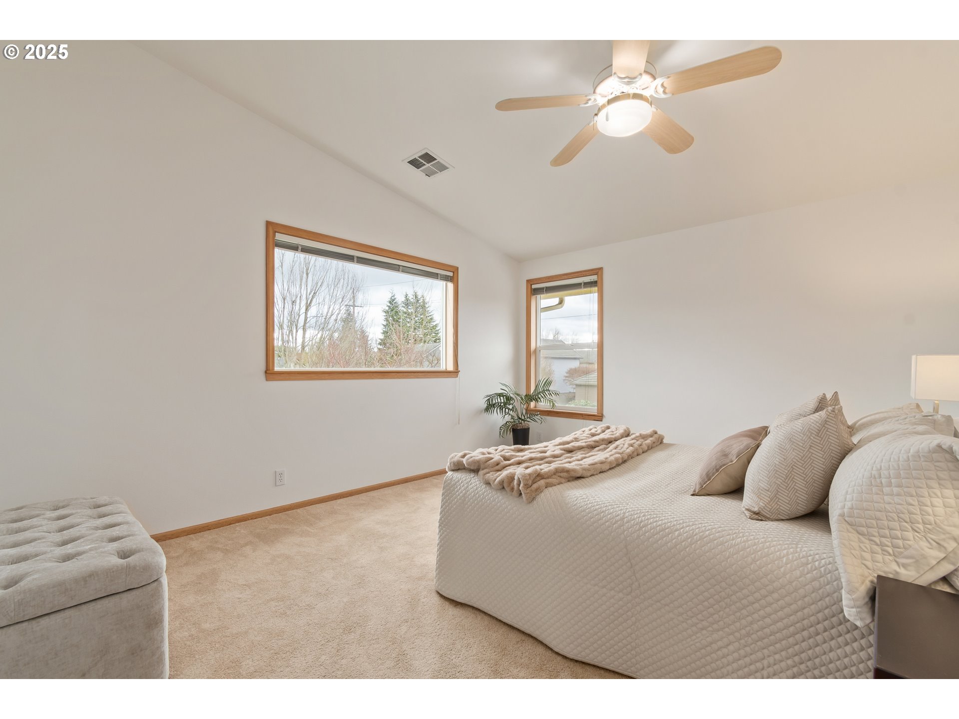 2360 Dale Avenue Eugene, OR 97408 - Photo 20 of 48 a bedroom with a bed chandelier and a window