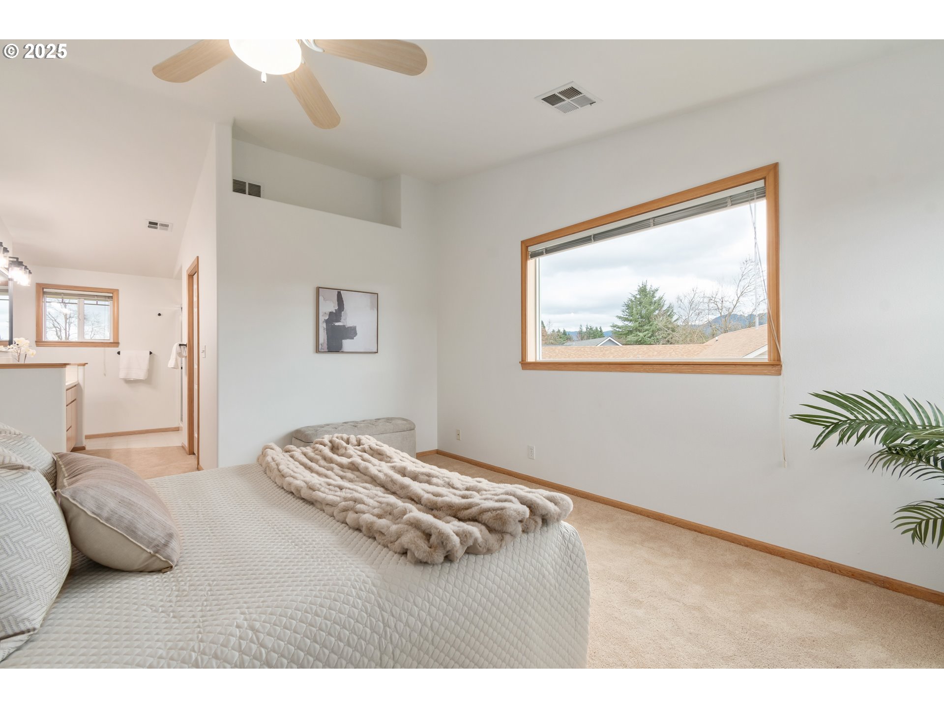 2360 Dale Avenue Eugene, OR 97408 - Photo 22 of 48 a bedroom with a bed and a painting on the wall