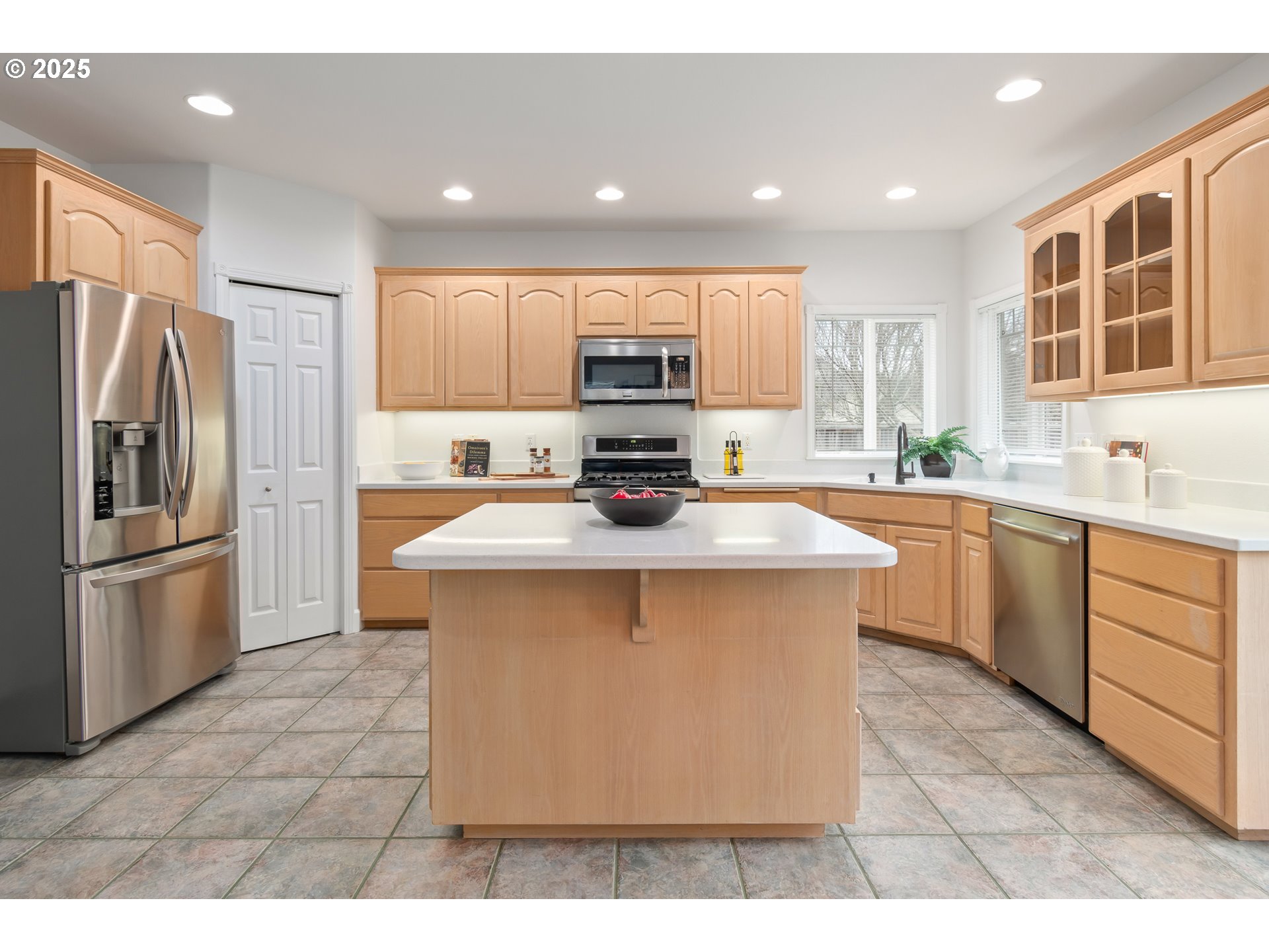 2360 Dale Avenue Eugene, OR 97408 - Photo 10 of 48 a kitchen with a stove a sink a refrigerator and a microwave