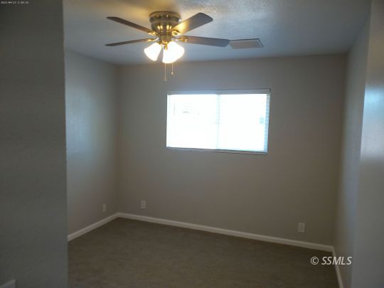 209 South Fire Opal Street Ridgecrest, CA 93555 - Photo 10 of 23 an empty room with a window