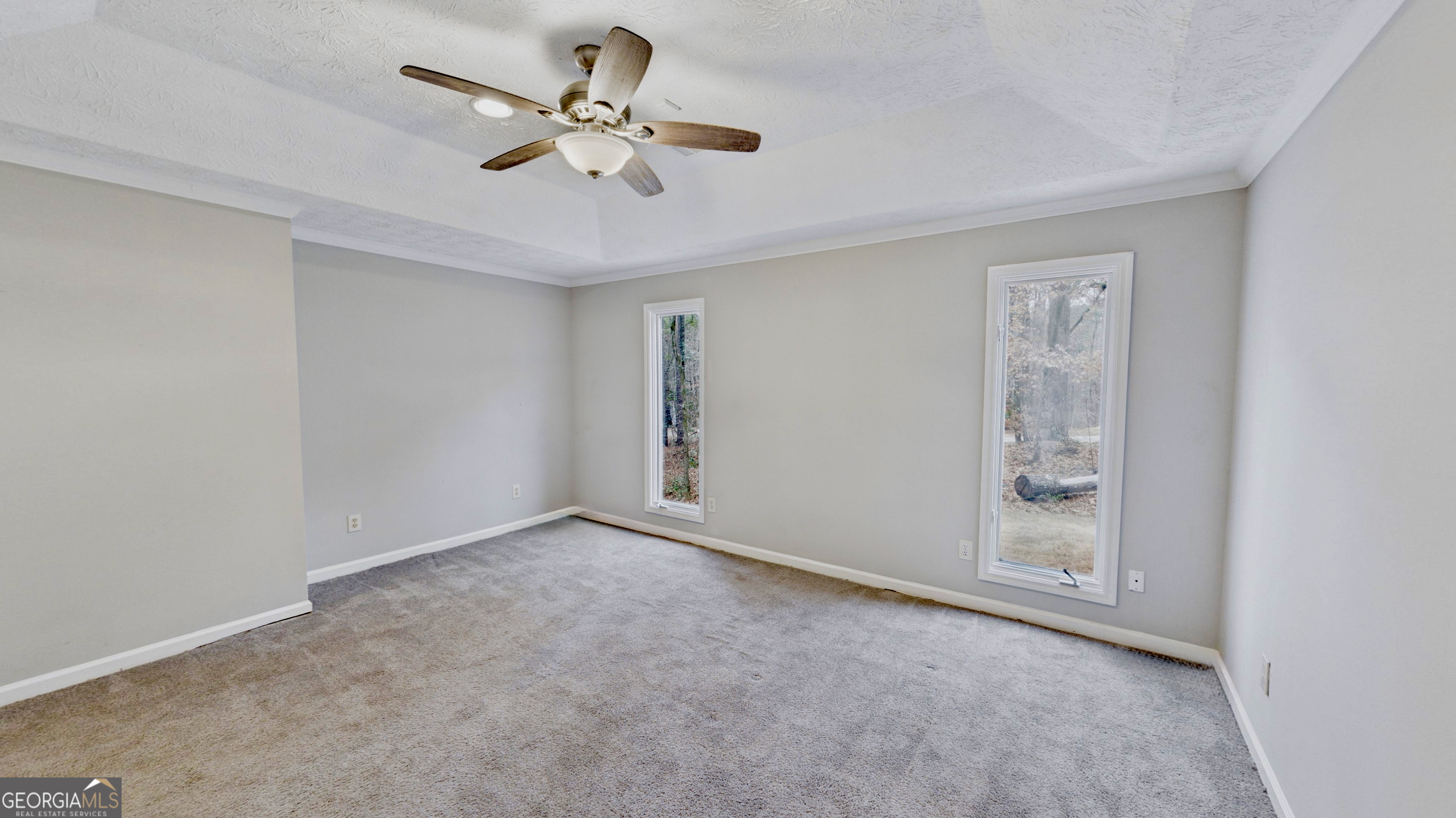 292 Blue Bird Trail Fortson, GA 31808 - Photo 17 of 45 an empty room with fan