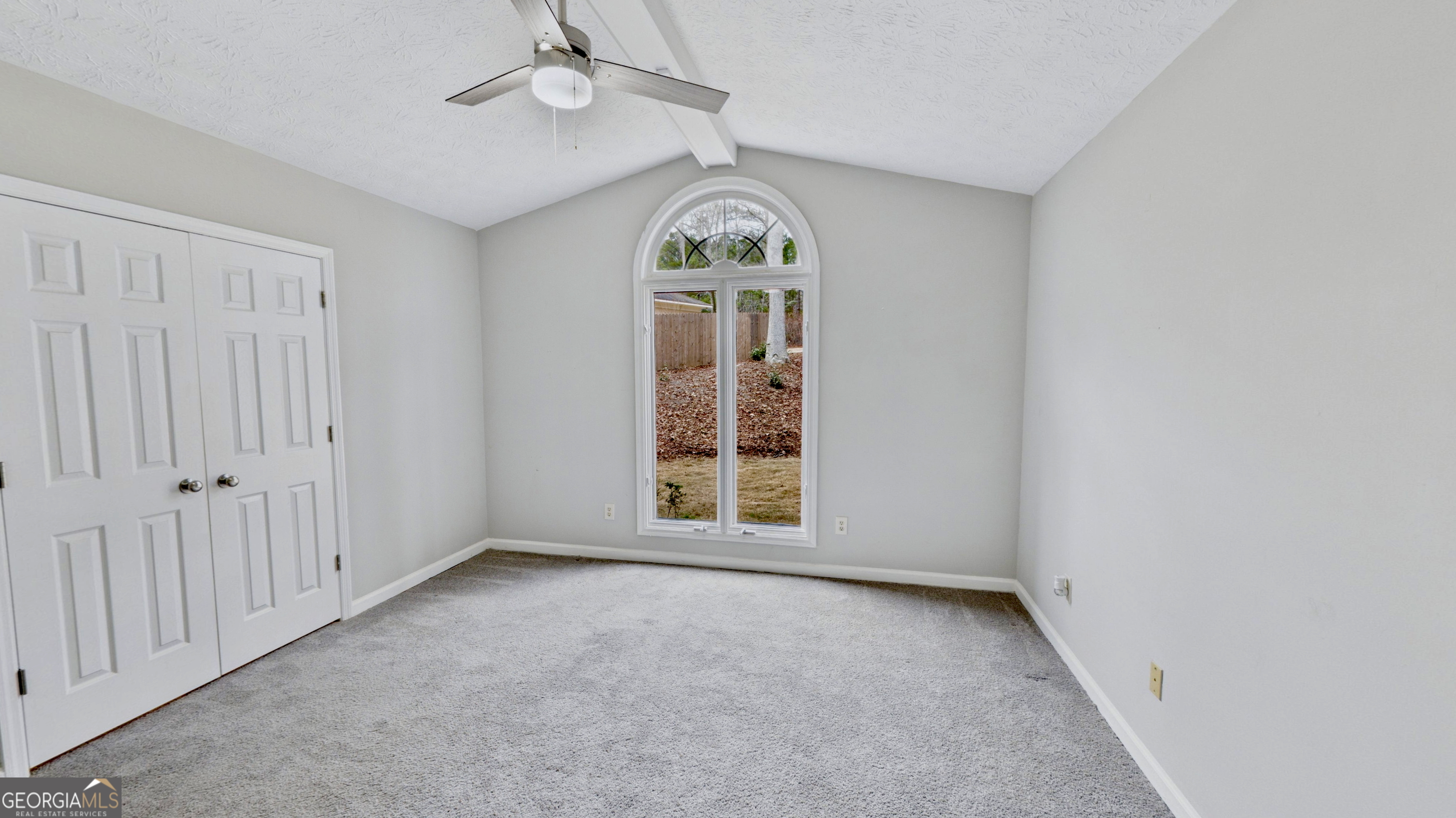 292 Blue Bird Trail Fortson, GA 31808 - Photo 31 of 45 an empty room with windows closet and chandelier fan