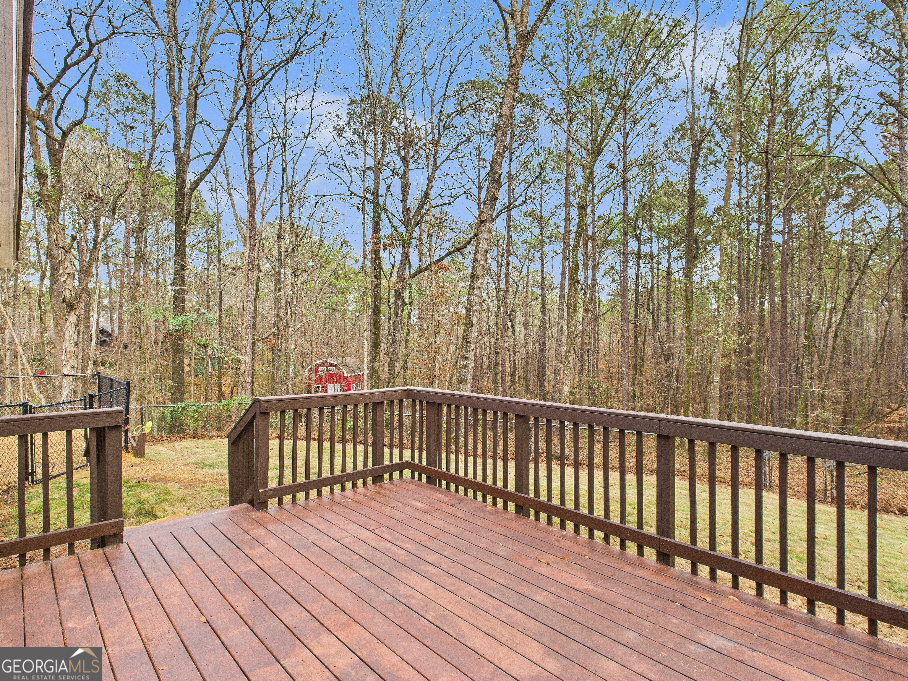 292 Blue Bird Trail Fortson, GA 31808 - Photo 35 of 45 a view of balcony with wooden floor and fence