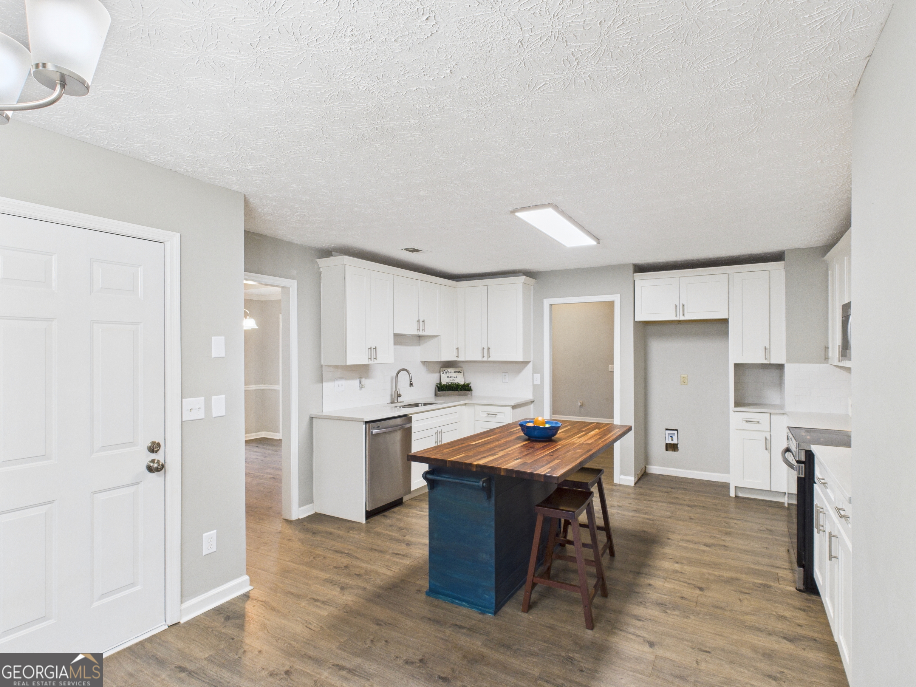 292 Blue Bird Trail Fortson, GA 31808 - Photo 10 of 45 a open kitchen with stainless steel appliances granite countertop a refrigerator and a stove top oven