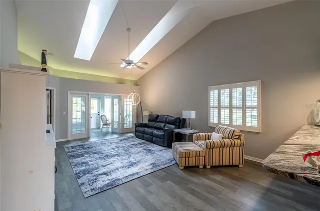 a living room with furniture window and wooden floor