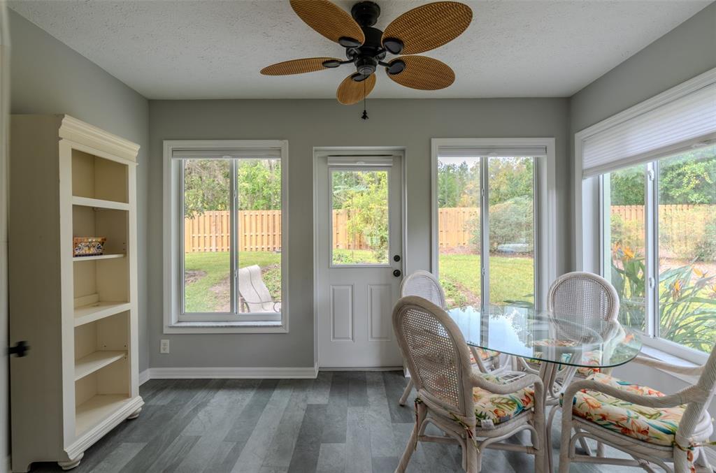 747 Inverie Drive Inverness, FL 34453 - Photo 18 of 40 a dining room with furniture a chandelier and wooden floor