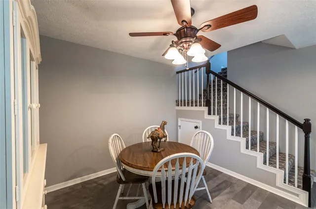 a view of a dining room with furniture window and wooden floor