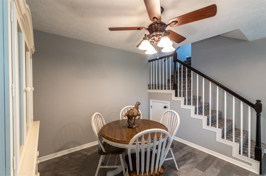 747 Inverie Drive Inverness, FL 34453 - Photo 22 of 40 a view of a dining room with furniture window and wooden floor
