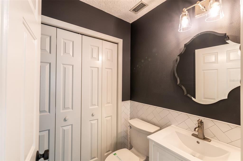 747 Inverie Drive Inverness, FL 34453 - Photo 23 of 40 a bathroom with a sink vanity mirror and toilet