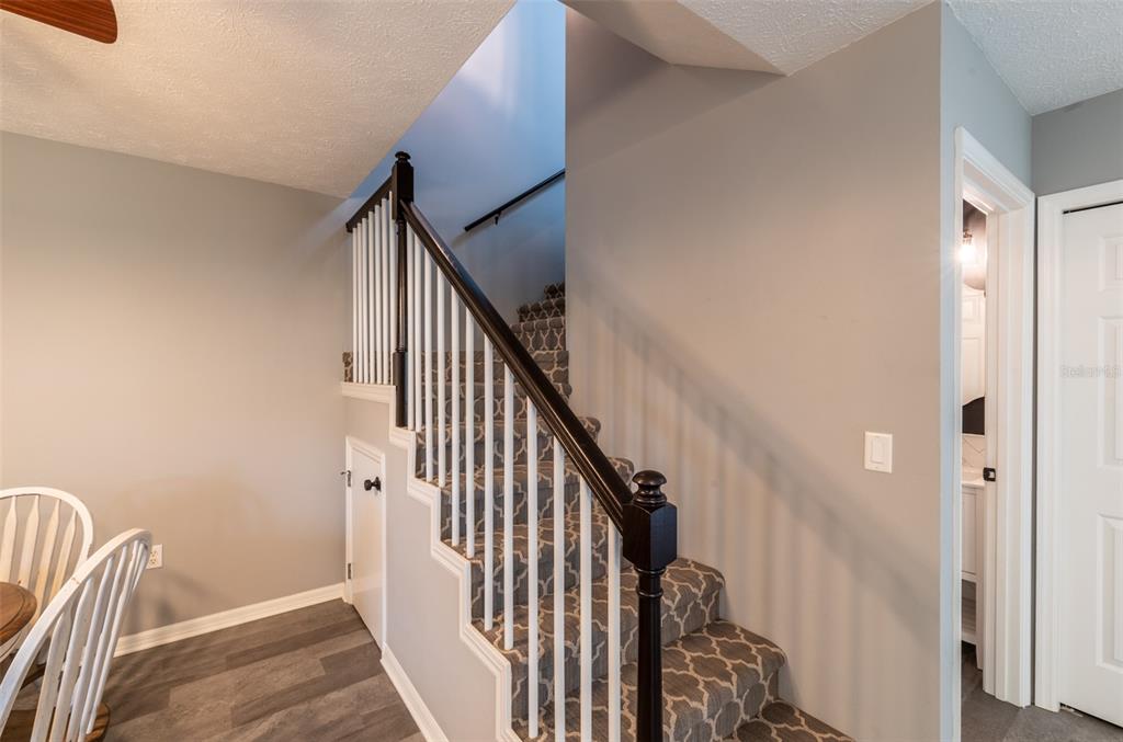 747 Inverie Drive Inverness, FL 34453 - Photo 30 of 40 a view of staircase with railing and white walls