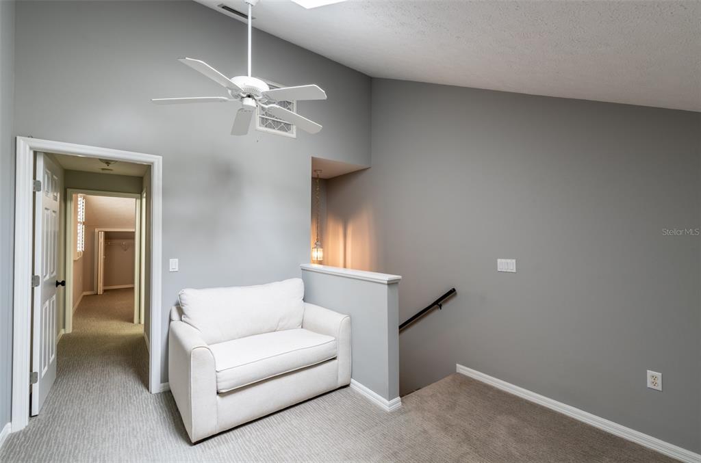 747 Inverie Drive Inverness, FL 34453 - Photo 32 of 40 a living room with furniture and a chandelier