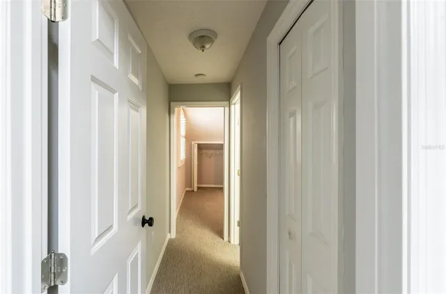 a view of a bathroom from a hallway