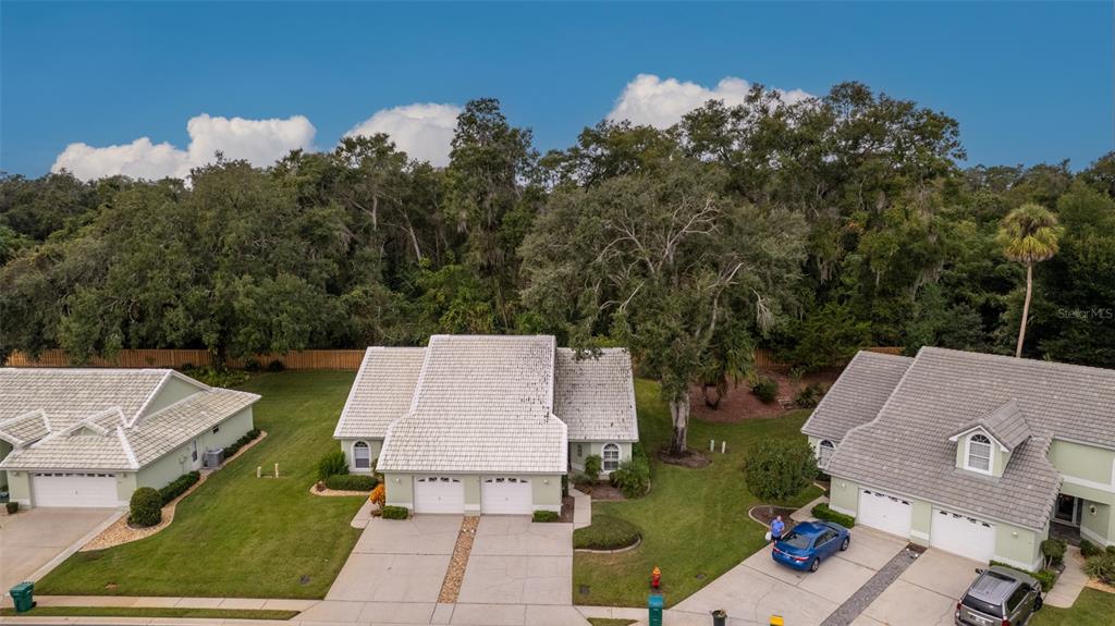 747 Inverie Drive Inverness, FL 34453 - Photo 37 of 40 an aerial view of a house with swimming pool and garden