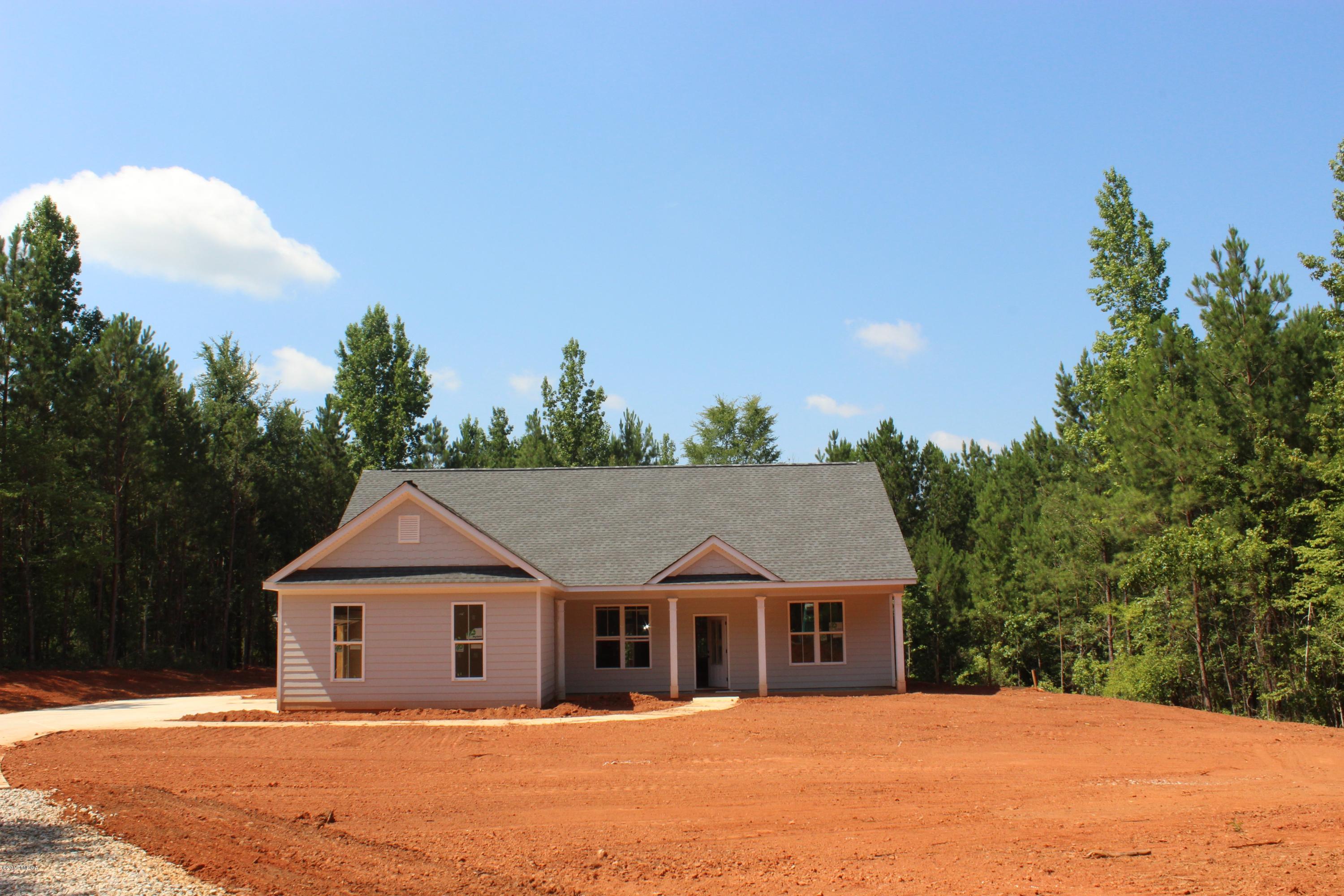 2748 Boxankle Road Forsyth, GA 31029 - Photo 1 of 6 a front view of a house with a yard and trees