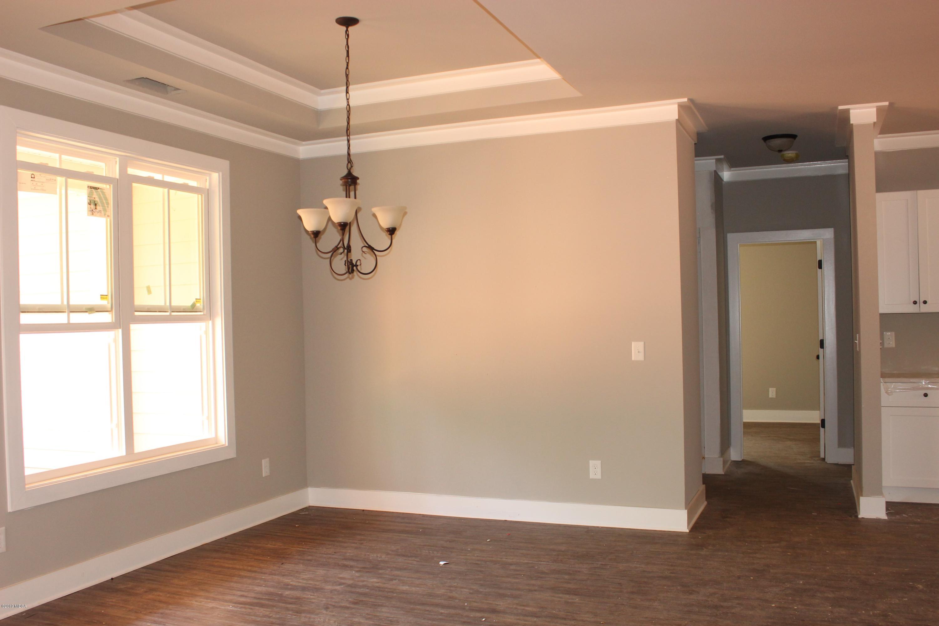 2748 Boxankle Road Forsyth, GA 31029 - Photo 4 of 6 a view of a room with window wooden floor and windows