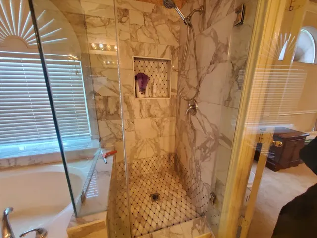 a view of a backyard with chairs and a table